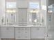 Modern bathroom with dual sinks, granite countertops, and glass-enclosed shower at 14531 Crosswater Ln, Charlotte, NC 28278