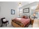 Cozy bedroom with natural light, a comfortable bed, and neutral decor at 14531 Crosswater Ln, Charlotte, NC 28278