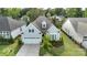 Charming single-Gathering home features a two-car garage, manicured lawn, and mature landscaping at 14531 Crosswater Ln, Charlotte, NC 28278