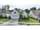 Charming two-story home with a well-manicured lawn, a two-car garage, and inviting curb appeal at 14531 Crosswater Ln, Charlotte, NC 28278