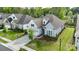 Charming blue two-story home with well-maintained landscaping, a manicured lawn, and inviting curb appeal at 14531 Crosswater Ln, Charlotte, NC 28278