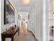 Well-lit hallway with hardwood floors, elegant decor, and access to other rooms at 14531 Crosswater Ln, Charlotte, NC 28278
