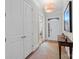 Inviting entryway with hardwood floors, elegant lighting, and decorative table at 14531 Crosswater Ln, Charlotte, NC 28278