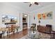 Comfortable living room with hardwood floors, French doors, stylish decor, and a ceiling fan at 14531 Crosswater Ln, Charlotte, NC 28278