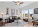Bright living room with large windows, hardwood floors, and elegant furniture at 14531 Crosswater Ln, Charlotte, NC 28278