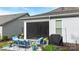 Outdoor patio with a screened-in porch, grill and plenty of comfortable seating at 14531 Crosswater Ln, Charlotte, NC 28278