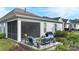 Back patio with a screened porch and patio furniture, perfect for outdoor entertaining at 14531 Crosswater Ln, Charlotte, NC 28278