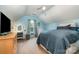 Serene bedroom with light blue walls, carpet, a large window, and a sloped ceiling for a cozy ambiance at 1533 Moss Creek Dr, Harrisburg, NC 28075