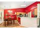 Charming dining area featuring a bold accent wall and an adjacent kitchen area at 1533 Moss Creek Dr, Harrisburg, NC 28075
