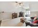Spacious bonus room with a vaulted ceiling, comfortable seating, bookshelf, and a large television at 15929 Northstone Dr, Huntersville, NC 28078