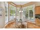 Cozy breakfast nook with lots of natural light from surrounding windows at 15929 Northstone Dr, Huntersville, NC 28078