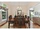Formal dining room with hardwood floors, chandelier, and neutral decor, perfect for entertaining at 15929 Northstone Dr, Huntersville, NC 28078