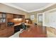 Spacious home office featuring custom built-ins, a large desk, and a bonus desk at 15929 Northstone Dr, Huntersville, NC 28078