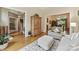 Elegant living room with hardwood floors, decorative area rug, and open access to other rooms at 15929 Northstone Dr, Huntersville, NC 28078