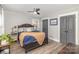 Comfortable bedroom with wood-look flooring, ceiling fan, and ample closet space at 1621 Brookdale Ave, Charlotte, NC 28210