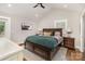 Spacious bedroom with vaulted ceiling, hardwood floors and stylish decor at 1621 Brookdale Ave, Charlotte, NC 28210
