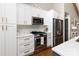 Well-lit kitchen features stainless steel appliances and white cabinetry at 1621 Brookdale Ave, Charlotte, NC 28210