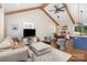 Bright open-concept living area with vaulted ceiling, wooden beams, and modern finishes at 1621 Brookdale Ave, Charlotte, NC 28210
