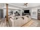 Open living room with a large sectional sofa and ceiling fan at 1621 Brookdale Ave, Charlotte, NC 28210