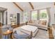 Well-lit open-concept living area with hardwood floors, neutral colors, and cozy furniture at 1621 Brookdale Ave, Charlotte, NC 28210