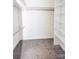 Walk-in closet with carpet, shelves, and clothing rods for storage at 169 Wilcox Karriker Ln, Statesville, NC 28625