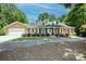 Charming one-story brick home with white trim, dormer windows, and a well-manicured front yard at 169 Wilcox Karriker Ln, Statesville, NC 28625