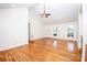 Bright living room featuring hardwood floors, large windows, and a high vaulted ceiling at 169 Wilcox Karriker Ln, Statesville, NC 28625