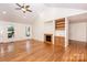 Living room featuring hardwood floors, fireplace with built-ins, and a high vaulted ceiling at 169 Wilcox Karriker Ln, Statesville, NC 28625