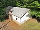 Aerial view of outbuilding with gray metal roof in wooded area at 169 Wilcox Karriker Ln, Statesville, NC 28625