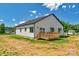 A sunny backyard featuring a small deck and home's exterior at 2104 County Line Rd, Kings Mountain, NC 28086