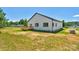 The home's backyard features a small deck and great privacy at 2104 County Line Rd, Kings Mountain, NC 28086