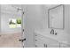 A beautifully designed bathroom featuring a large vanity with a modern sink and a view to the bedroom at 2104 County Line Rd, Kings Mountain, NC 28086