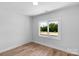 Bedroom features a large window offering natural light and hardwood floors at 2104 County Line Rd, Kings Mountain, NC 28086
