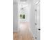 Bright hallway with wood floors leads to a bedroom with natural lighting at 2104 County Line Rd, Kings Mountain, NC 28086