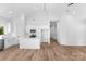 Bright kitchen with stainless appliances, white cabinetry, a center island, and hardwood floors at 2104 County Line Rd, Kings Mountain, NC 28086