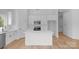 Bright, white kitchen featuring a large island, modern appliances, and stylish countertops at 2104 County Line Rd, Kings Mountain, NC 28086