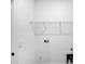 Bright laundry room with white walls, wire shelving, and hookups for washer and dryer at 2104 County Line Rd, Kings Mountain, NC 28086
