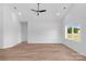 A large living room featuring a ceiling fan and a window for natural light at 2104 County Line Rd, Kings Mountain, NC 28086