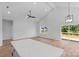 Bright living space featuring vaulted ceiling, hardwood-style flooring, and access to the outdoor deck at 2104 County Line Rd, Kings Mountain, NC 28086