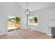 Open-concept living and dining area with deck access, featuring lots of natural light at 2104 County Line Rd, Kings Mountain, NC 28086