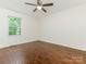 Bright and spacious bedroom featuring hardwood floors and a large window at 2240 Lawton Bluff Rd, Charlotte, NC 28226