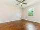 Bedroom with hardwood floors, a ceiling fan, one window, and light pink walls at 2240 Lawton Bluff Rd, Charlotte, NC 28226