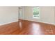 Bright living room featuring hardwood floors and a window at 2240 Lawton Bluff Rd, Charlotte, NC 28226