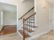 Elegant staircase with hardwood steps and ornate iron railings at 2240 Lawton Bluff Rd, Charlotte, NC 28226