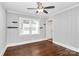 Bright bedroom with natural light, hardwood floors, and ceiling fan at 2421 Shamrock Dr, Charlotte, NC 28205