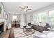 Inviting living room showcasing a fireplace, large windows, and comfortable seating area at 2421 Shamrock Dr, Charlotte, NC 28205