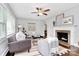 Comfortable living room with a ceiling fan, fireplace, and stylish furnishings at 2421 Shamrock Dr, Charlotte, NC 28205