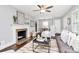 Bright living room with a fireplace, wood floors, and modern decor at 2421 Shamrock Dr, Charlotte, NC 28205