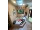 Bathroom with a jacuzzi tub, tiled floor, and a window view to the outside greenery for a tranquil retreat at 2505 White Thorne Ln, Waxhaw, NC 28173