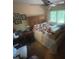 Cluttered bedroom with boxes and dolls adorning the bed and nearby desk at 2505 White Thorne Ln, Waxhaw, NC 28173